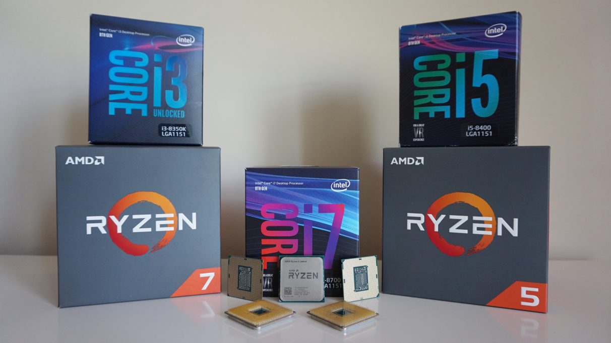 A collection of Intel and AMD CPUs on a table.