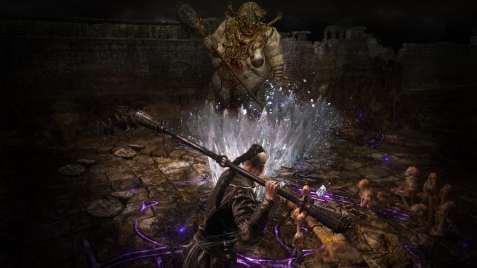 A monk prepares to fight a large boss monster in Path Of Exile 2