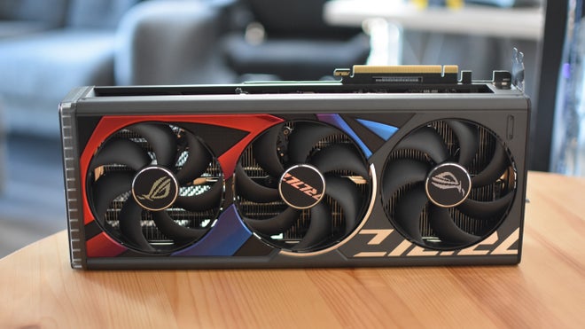 The triple-fan cooler on the Asus ROG Strix GeForce RTX 4080 OC Edition graphics card.